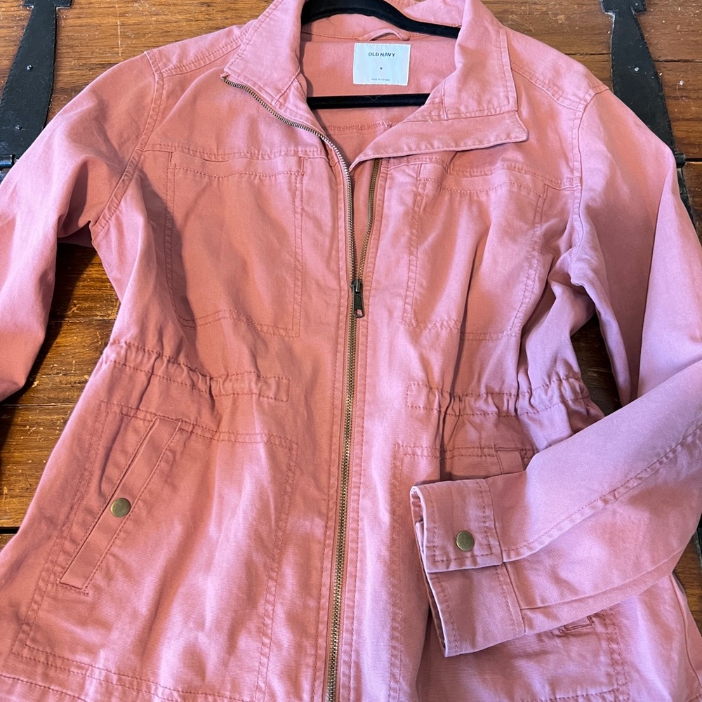 rose colored jacket.